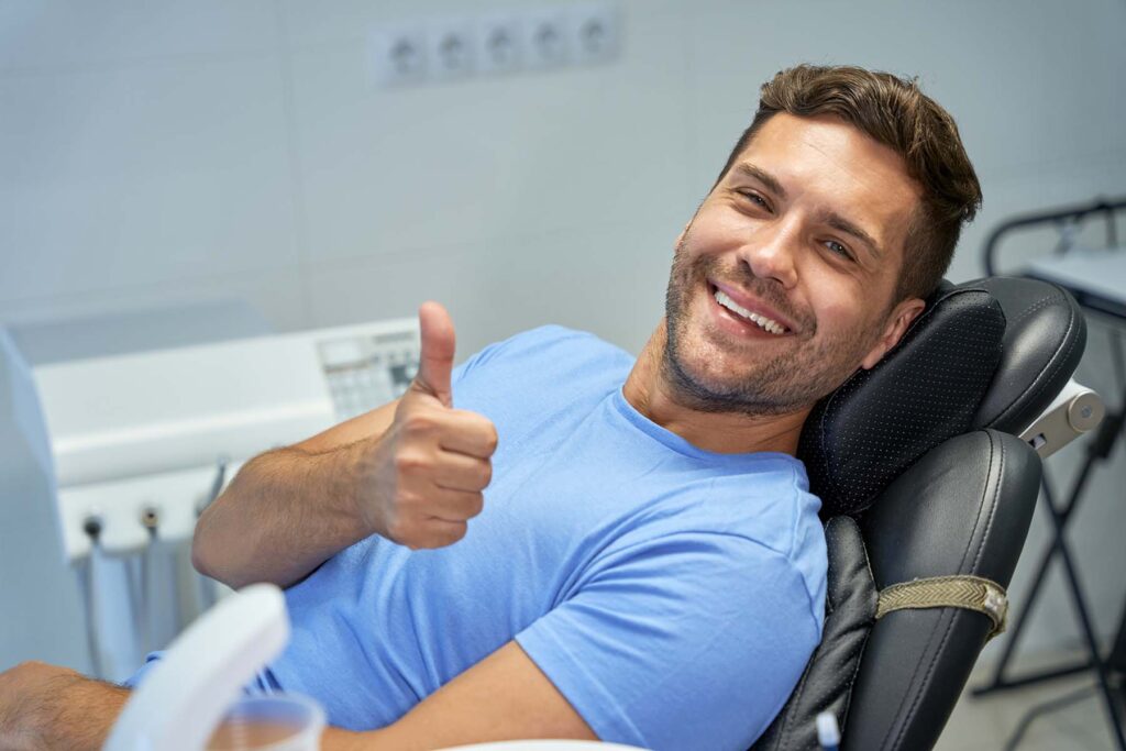 Happy patient receiving dental care at GT Dental Studio