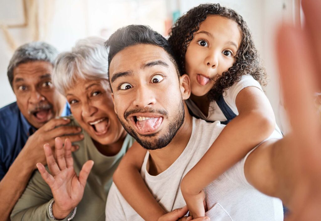 Family celebrating dental care affordability